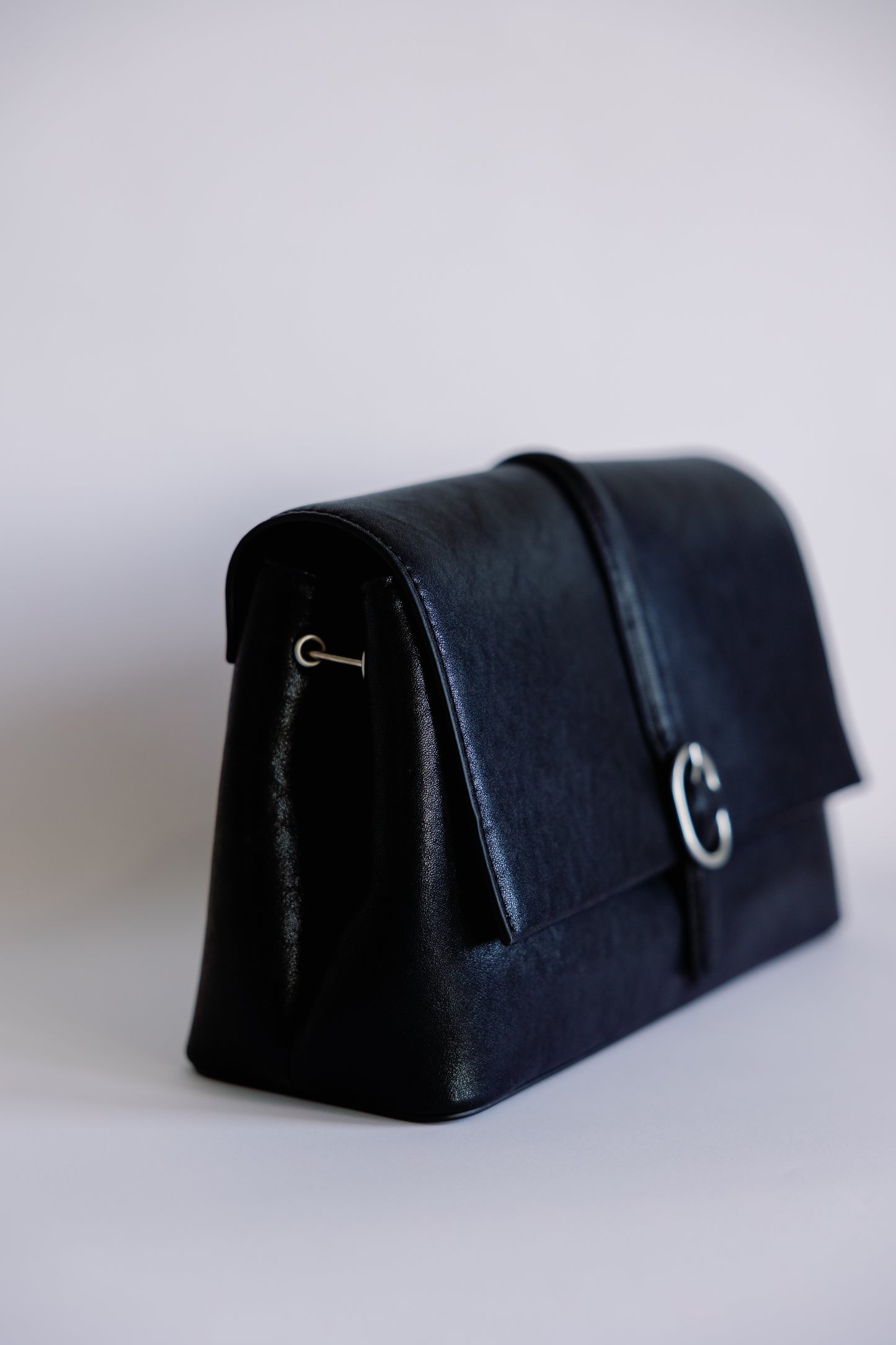 The O Buckle Clutch