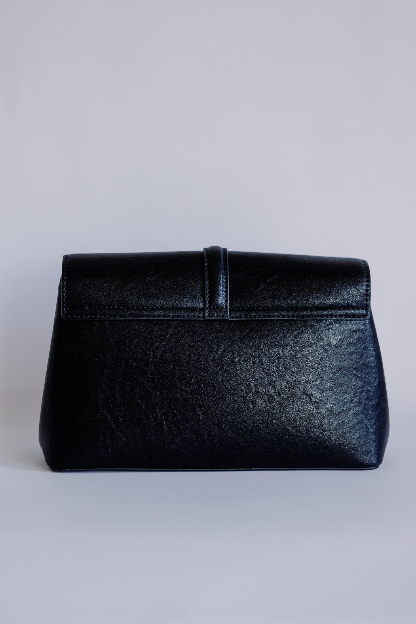 The O Buckle Clutch